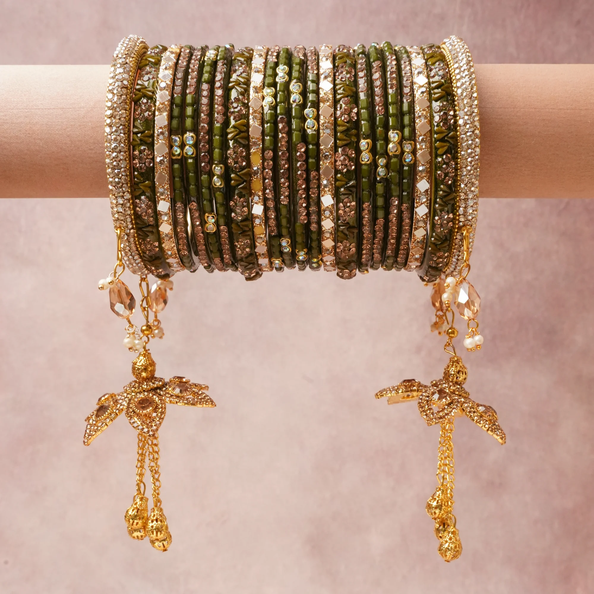 A commanding Deep Olive Green anchors this beautiful set, enriched with accents of Clear Crystal, Champagne Crystal, White Pearl that add depth and dimension.

Featuring a striking composition of Glass, Crystal, Gold-toned Metal, Faux Pearl, this set carries intricate craftsmanship and strong presence. Grand in form, it is created for moments that deserve to be marked.